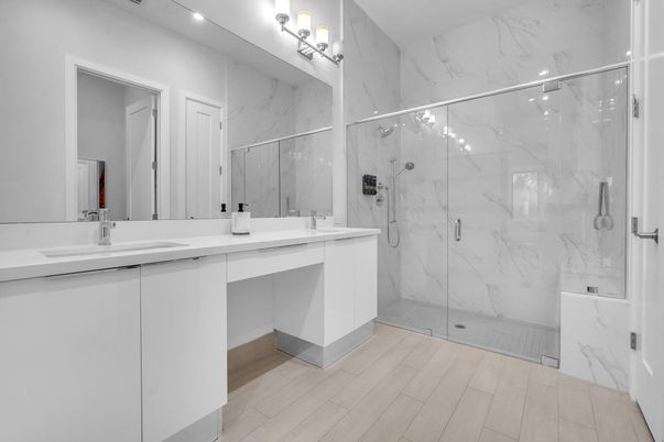 Bathroom, Dual Sink Vanities, Glass Shower, Interior, Marble Walls, Wood Texture Flooring
