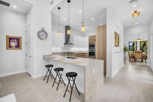 Dining room, Interior, Kitchen, Pendant Lights, Recessed Lighting, Stainless Steel Appliances, Wood Texture Flooring