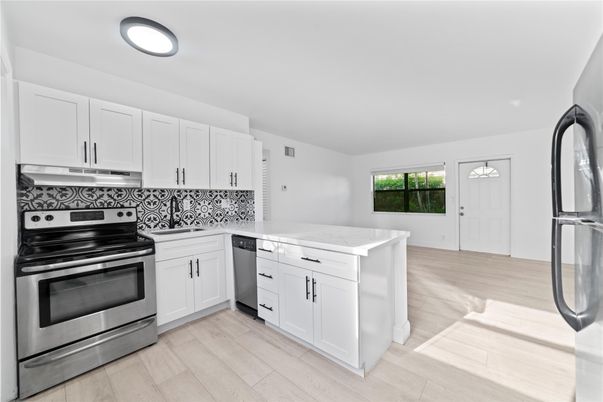 Interior, Kitchen, Recessed Lighting, Stainless Steel Appliances, Wood Texture Flooring