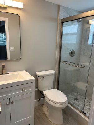 Bathroom, Glass Shower, Interior, Marble Walls, Wood Texture Flooring