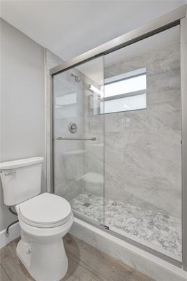 Bathroom, Glass Shower, Interior, Marble Walls, Wood Texture Flooring
