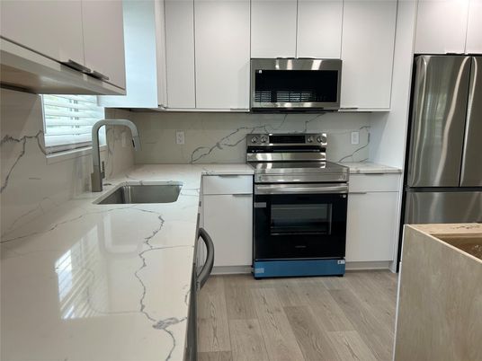 Interior, Kitchen, Marble Walls, Stainless Steel Appliances, Wood Texture Flooring