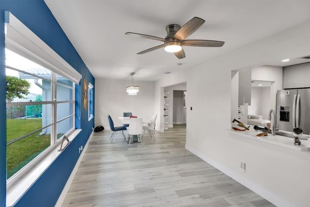 Chandelier, Dining room, Interior, Kitchen, Recessed Lighting, Stainless Steel Appliances, Wood Texture Flooring