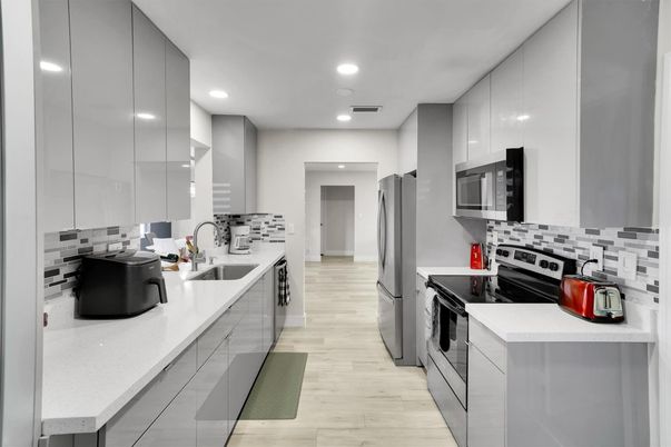 Interior, Kitchen, Recessed Lighting, Stainless Steel Appliances, Wood Texture Flooring