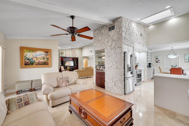Dining room, Interior, Kitchen, Living room, Marble Walls, Recessed Lighting, Stainless Steel Appliances, Stone Walls