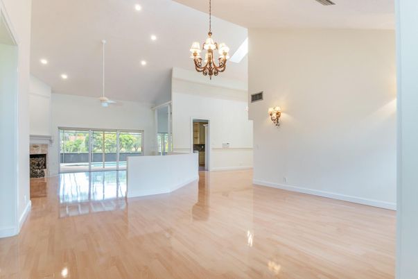 Chandelier, Empty room, Fireplace, Interior, Recessed Lighting, Wood Texture Flooring