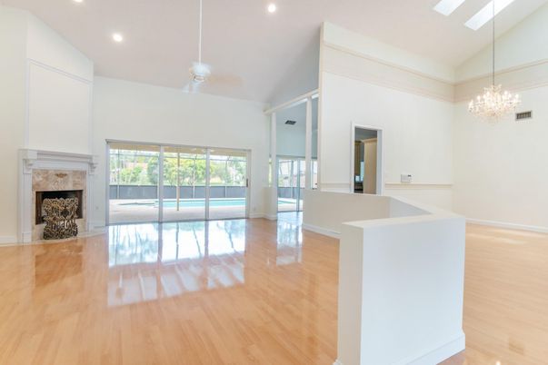 Chandelier, Empty room, Fireplace, Interior, Recessed Lighting, Wood Texture Flooring