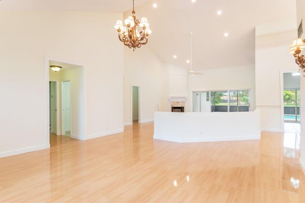 Chandelier, Empty room, Fireplace, Interior, Recessed Lighting, Wood Texture Flooring