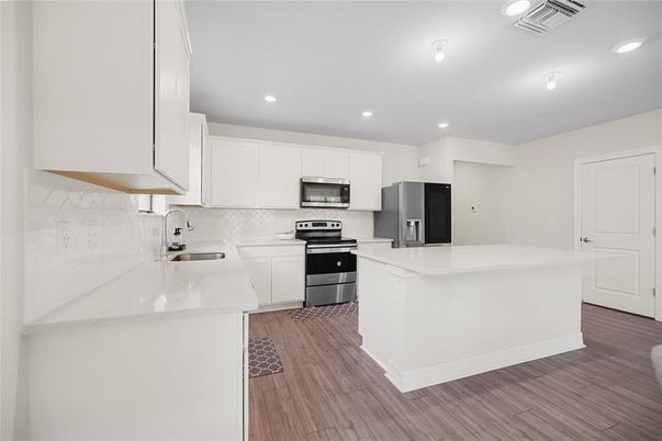 Interior, Kitchen, Recessed Lighting, Stainless Steel Appliances, Wood Texture Flooring