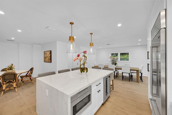 Dining room, Interior, Kitchen, Pendant Lights, Recessed Lighting, Stainless Steel Appliances, Wood Texture Flooring