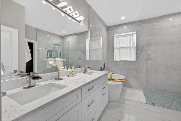 Bathroom, Dual Sink Vanities, Glass Shower, Interior, Marble, Marble Walls, Recessed Lighting