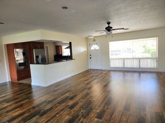 Empty room, Interior, Kitchen, Stainless Steel Appliances, Wood Texture Flooring