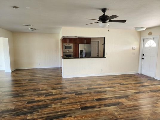 Empty room, Interior, Kitchen, Stainless Steel Appliances, Wood Texture Flooring