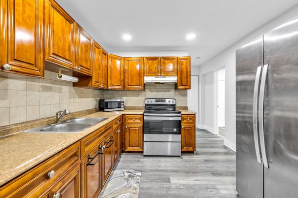 Interior, Kitchen, Recessed Lighting, Stainless Steel Appliances, Wood Texture Flooring