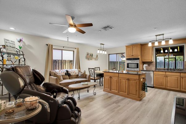 Dining room, Interior, Kitchen, Living room, Pendant Lights, Recessed Lighting, Stainless Steel Appliances, Wood Texture Flooring