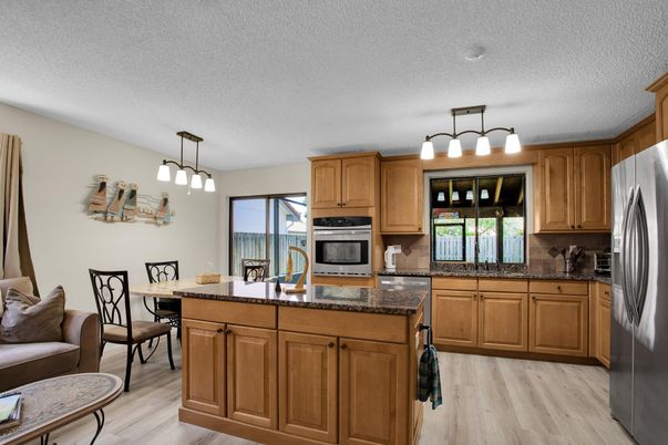 Dining room, Interior, Kitchen, Pendant Lights, Stainless Steel Appliances, Wood Texture Flooring