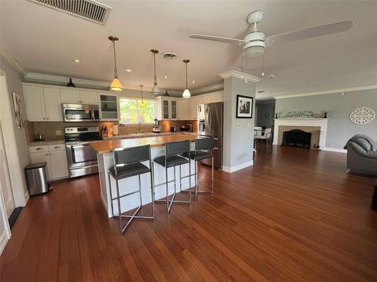 Fireplace, Interior, Kitchen, Pendant Lights, Recessed Lighting, Stainless Steel Appliances, Wood Texture Flooring