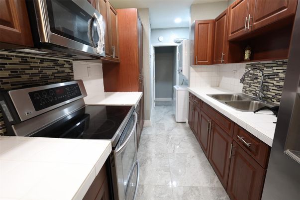 Interior, Kitchen, Recessed Lighting, Stainless Steel Appliances, Tile Countertops