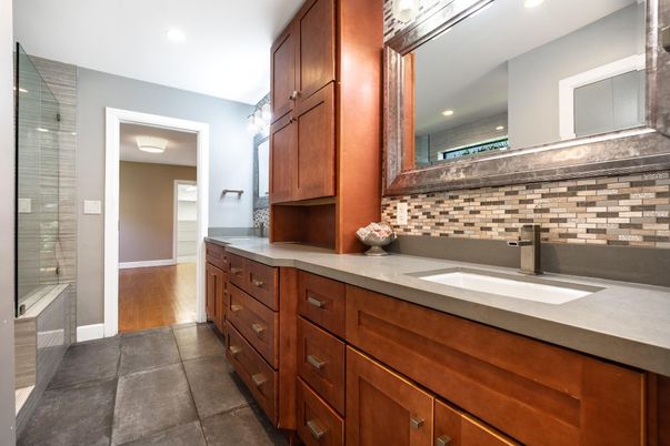 Bathroom, Dual Sink Vanities, Glass Shower, Interior, Recessed Lighting, Wood Texture Flooring