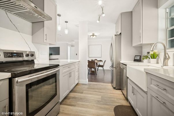 Dining room, Interior, Kitchen, Pendant Lights, Stainless Steel Appliances, Wood Texture Flooring