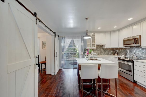 Dining room, Interior, Kitchen, Pendant Lights, Recessed Lighting, Stainless Steel Appliances, Wood Texture Flooring
