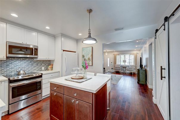 Dining room, Interior, Kitchen, Pendant Lights, Recessed Lighting, Stainless Steel Appliances, Wood Texture Flooring