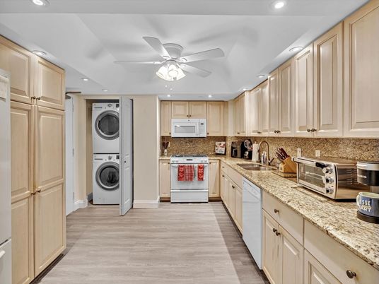 Interior, Kitchen, Recessed Lighting, Washer, Wood Texture Flooring