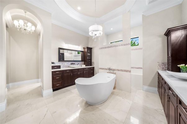 Bathroom, Chandelier, Free Standing Baths, Interior, Marble, Pendant Lights, Recessed Lighting