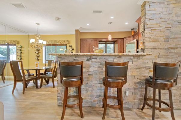 Chandelier, Dining room, Interior, Pendant Lights, Recessed Lighting, Stone Walls, Wood Texture Flooring