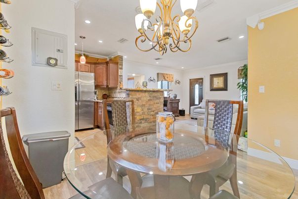 Chandelier, Dining room, Interior, Kitchen, Pendant Lights, Recessed Lighting, Stainless Steel Appliances, Wood Texture Flooring