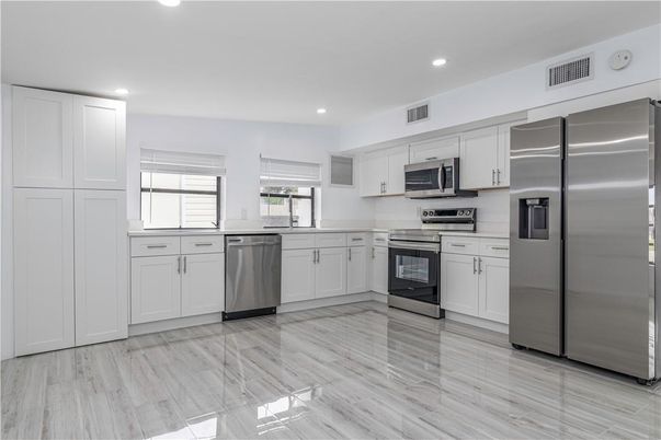 Interior, Kitchen, Recessed Lighting, Stainless Steel Appliances, Wood Texture Flooring