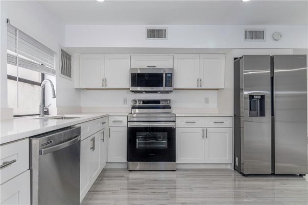 Interior, Kitchen, Recessed Lighting, Stainless Steel Appliances, Wood Texture Flooring