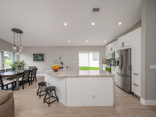 Dining room, Interior, Kitchen, Pendant Lights, Recessed Lighting, Stainless Steel Appliances, Wood Texture Flooring