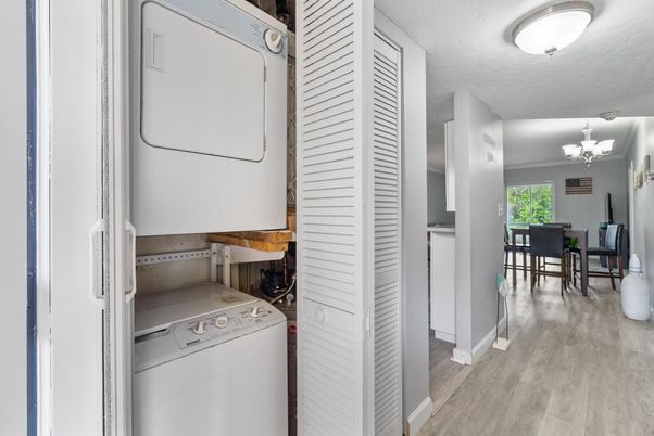 Chandelier, Dining room, Interior, Utility Closets, Washer, Wood Texture Flooring