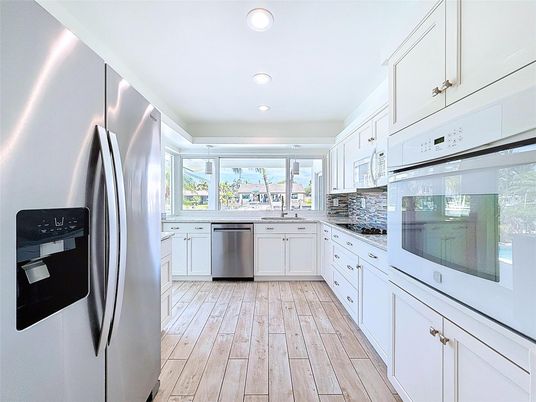 Interior, Kitchen, Recessed Lighting, Stainless Steel Appliances, Wood Texture Flooring