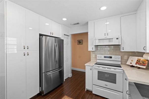 Interior, Kitchen, Recessed Lighting, Stainless Steel Appliances, Wood Texture Flooring