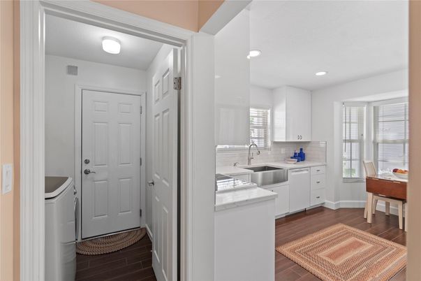 Interior, Kitchen, Recessed Lighting, Washer, Wood Texture Flooring
