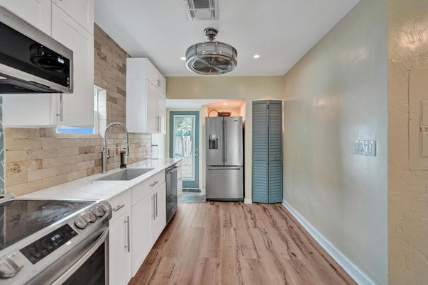 Interior, Kitchen, Recessed Lighting, Stainless Steel Appliances, Wood Texture Flooring