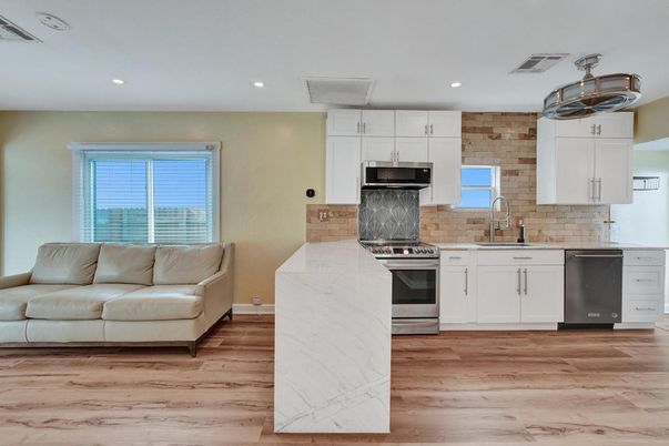 Interior, Kitchen, Recessed Lighting, Stainless Steel Appliances, Stone Walls, Wood Texture Flooring
