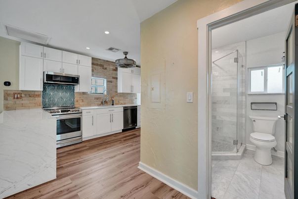 Interior, Kitchen, Recessed Lighting, Stainless Steel Appliances, Wood Texture Flooring