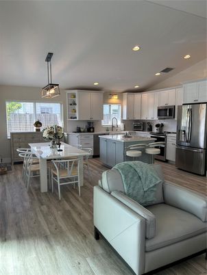 Dining room, Interior, Kitchen, Pendant Lights, Recessed Lighting, Stainless Steel Appliances, Wood Texture Flooring
