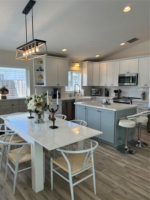 Dining room, Interior, Kitchen, Pendant Lights, Recessed Lighting, Stainless Steel Appliances, Wood Texture Flooring