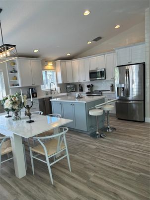 Dining room, Interior, Kitchen, Pendant Lights, Recessed Lighting, Stainless Steel Appliances, Wood Texture Flooring