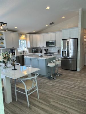 Interior, Kitchen, Recessed Lighting, Stainless Steel Appliances, Wood Texture Flooring