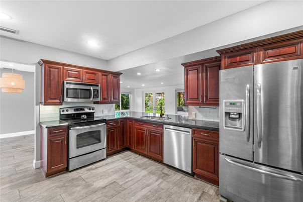 Interior, Kitchen, Recessed Lighting, Stainless Steel Appliances, Wood Texture Flooring
