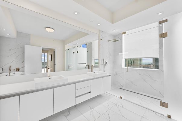Bathroom, Dual Sink Vanities, Glass Shower, Interior, Marble, Marble Walls, Recessed Lighting