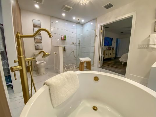 Bathroom, Free Standing Baths, Glass Shower, Interior, Recessed Lighting, Wood Texture Flooring