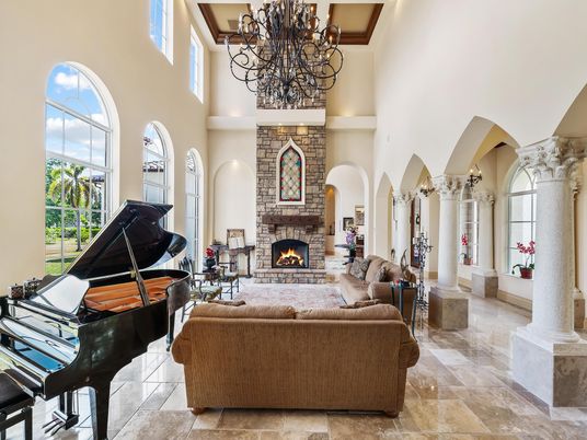 Chandelier, Fireplace, Interior, Living room, Piano, Stone Walls