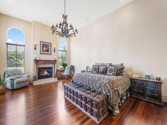Bedroom, Chandelier, Fireplace, Interior, Recessed Lighting, Wood Texture Flooring