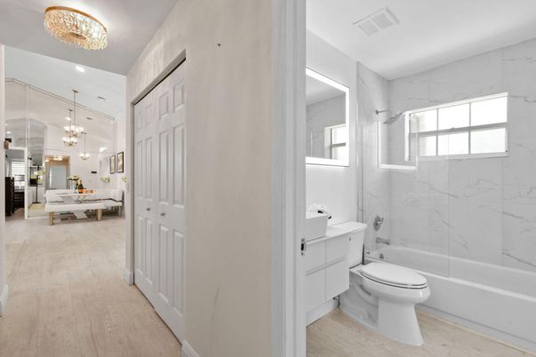 Bathroom, Chandelier, Dining room, Glass Shower, Interior, Marble Walls, Wood Texture Flooring